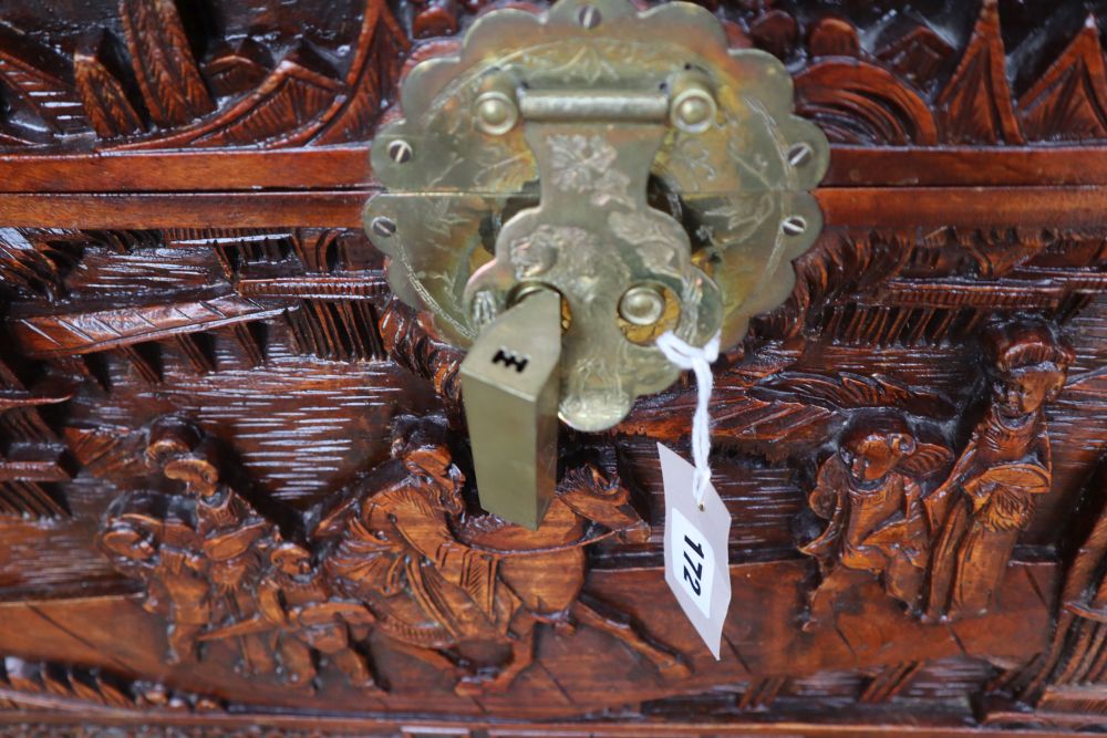 A Chinese carved camphorwood trunk, width 100cm depth 50cm height 58cm